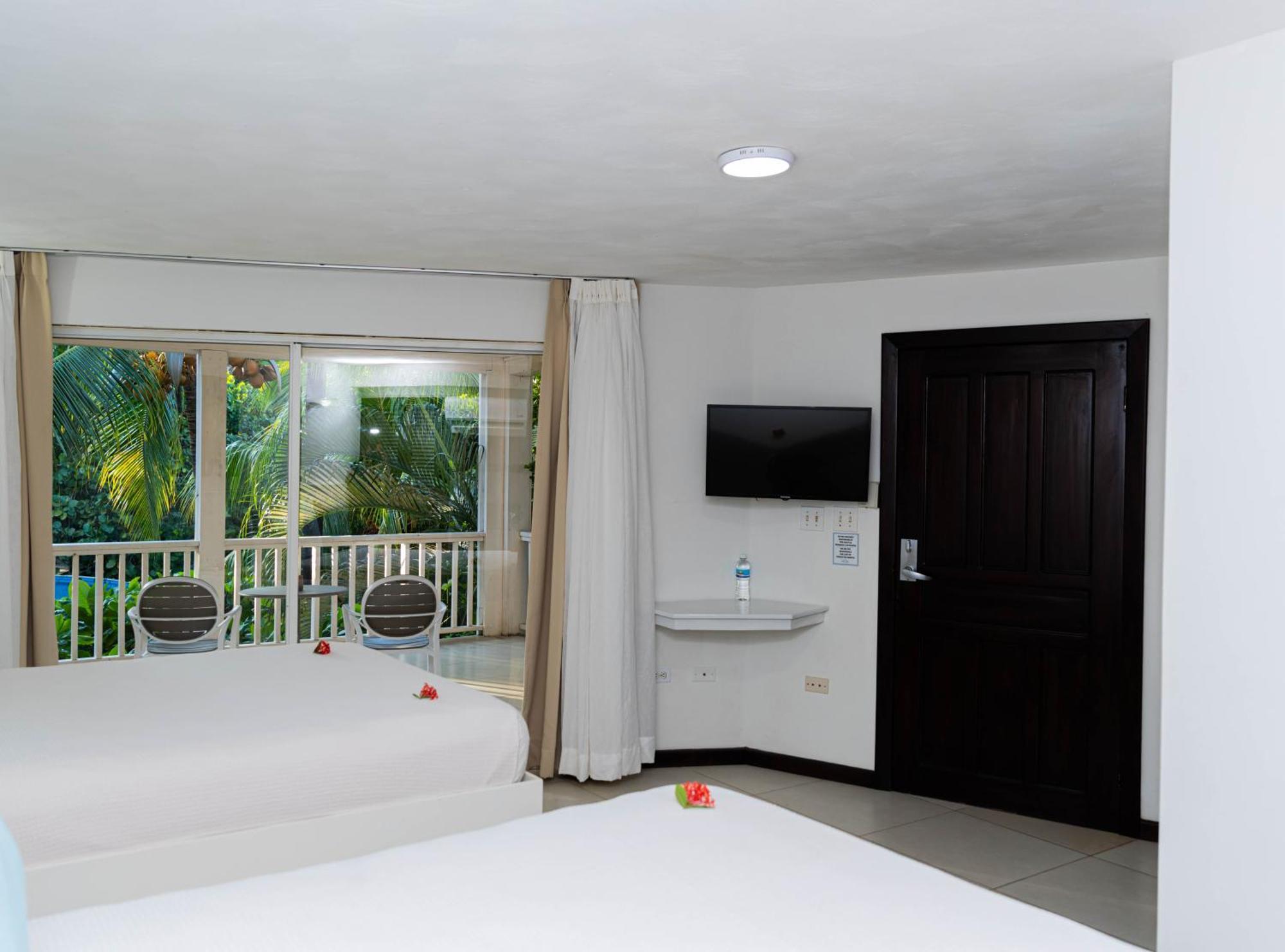 Paradise Beach Hotel & Resort West Bay Værelse billede